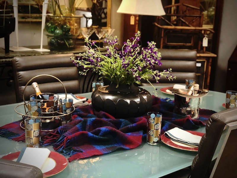 Diane uses a brightly colored afghan style wool throw blanket as the base for her contemporary centerpiece